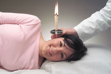 Lady having ear treatment with otosan cone